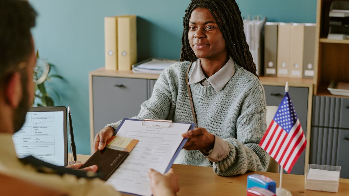 USCIS officer reviewing N-400 application during citizenship interview 2026